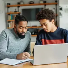 Dad helping son