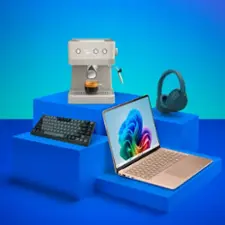 Coffee maker, headphones, keyboard, laptop