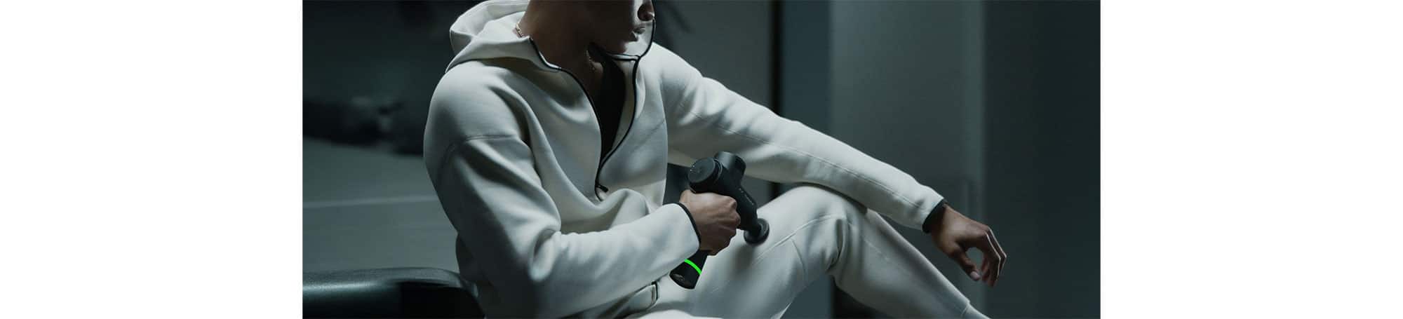 Person using percussion massager