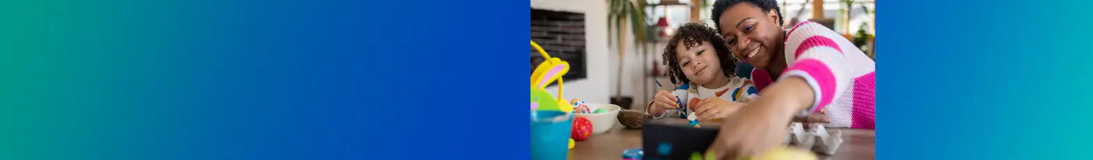 Mother son taking selfie coloring easter eggs