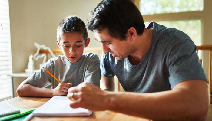 Dad helping son