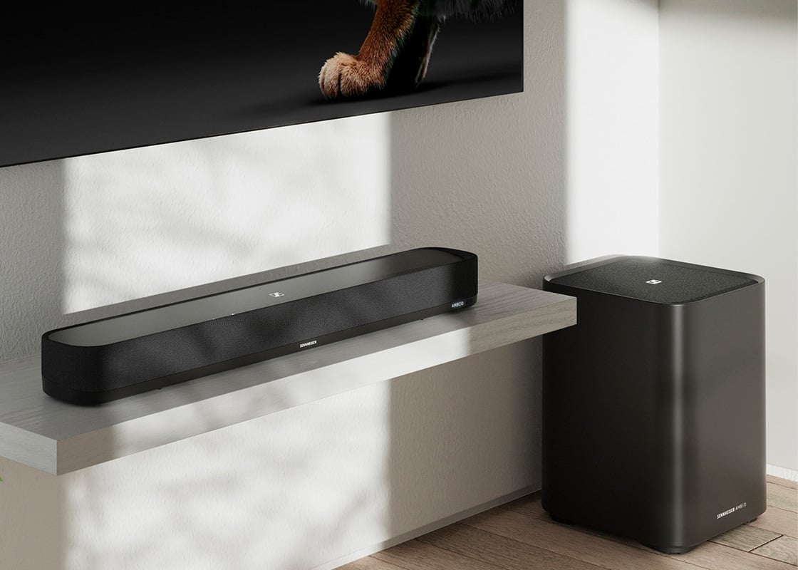 AMBEO Soundbar on shelf under TV.