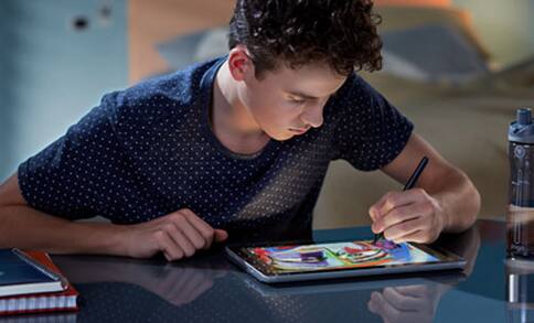 Teen working on tablet