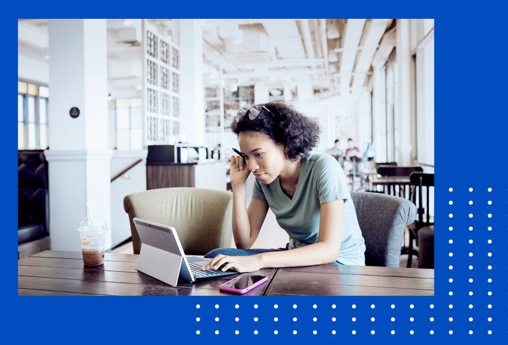 Student working on laptop.