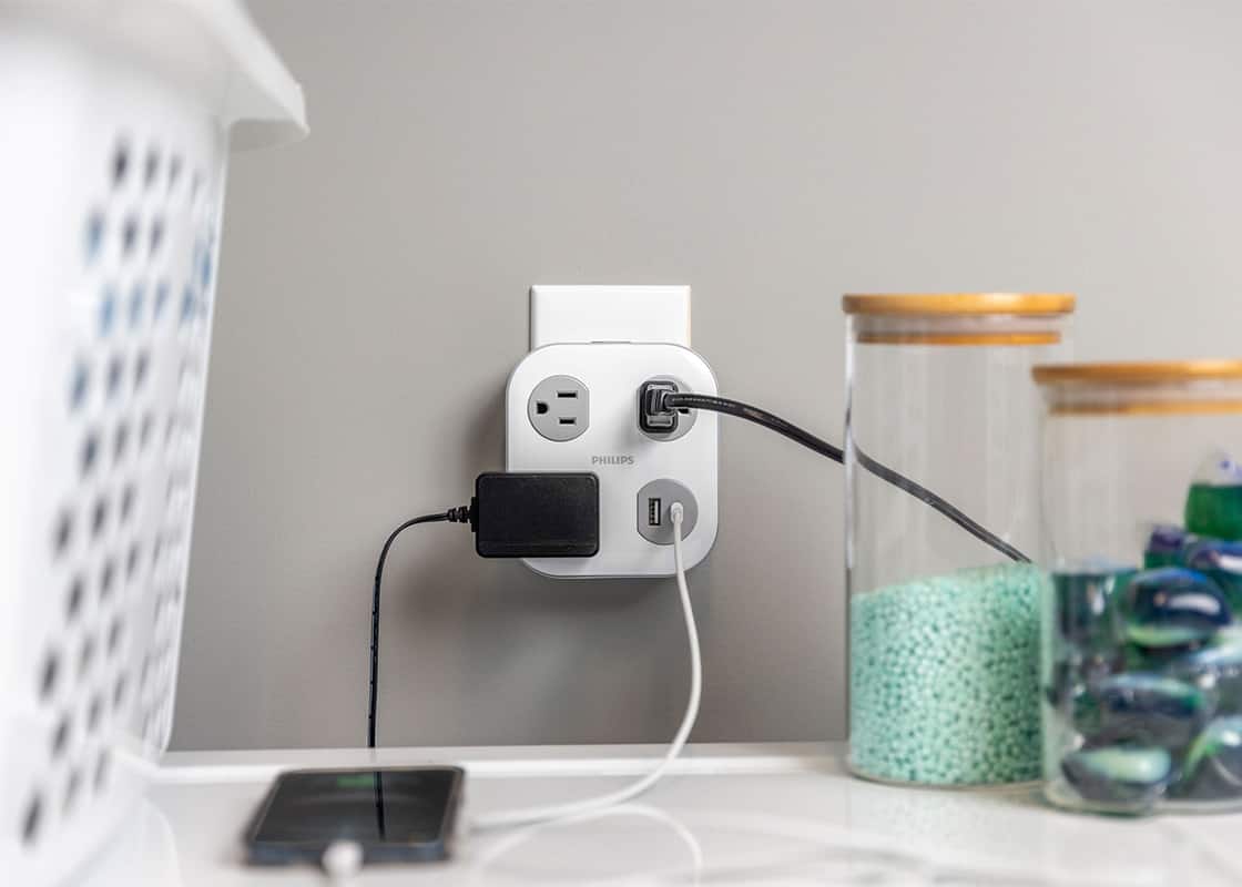 Philips surge protector near laundry.	