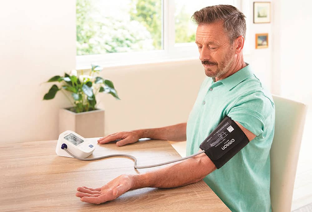 Person using blood pressure monitor 