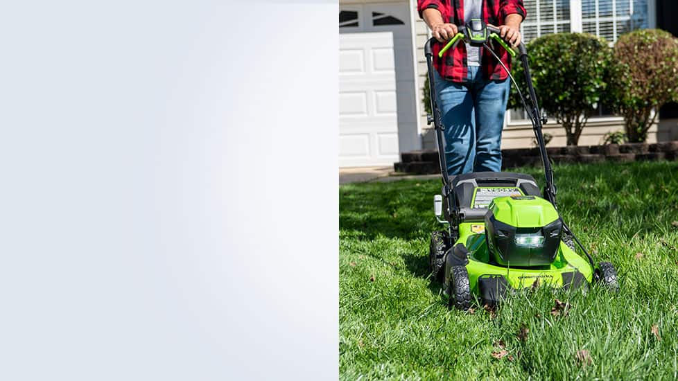 Individual mowing lawn