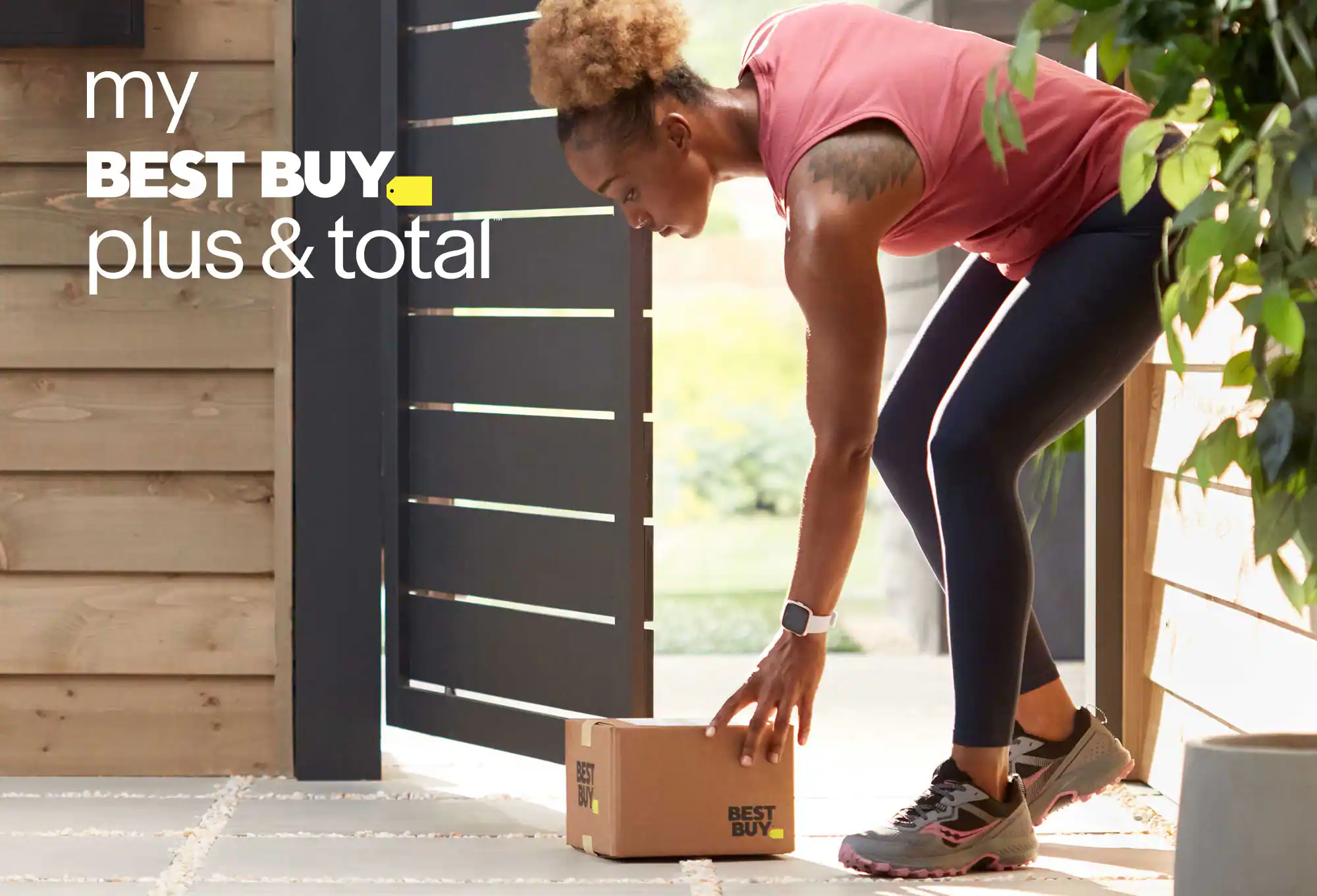 My Best Buy Plus & TotalTM - Woman picking up delivered box