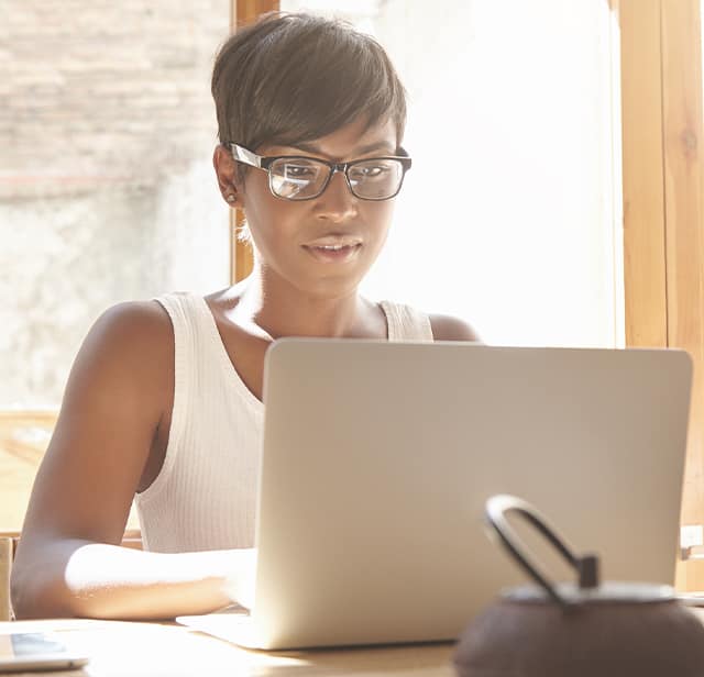 Woman on a laptop.