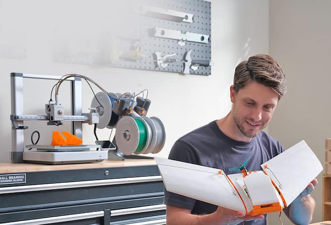 Man using 3 D printer