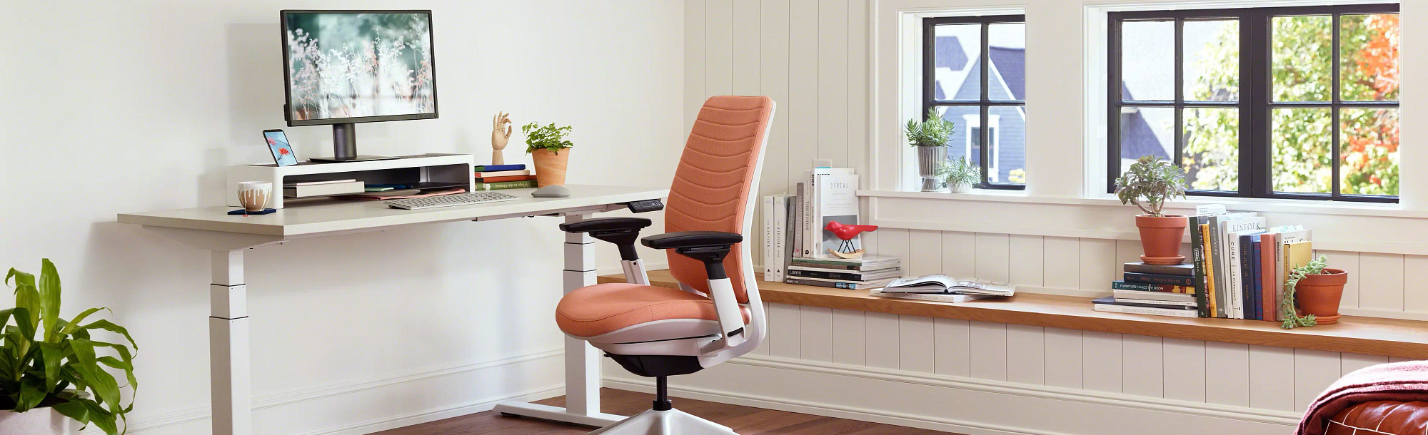 Orange chair and white desk in office