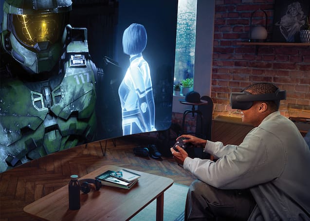 Person playing video game with visual inside headset.