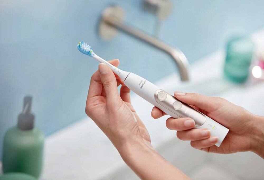Power flosser/toothbrush system