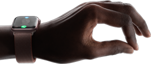 A person wearing Apple Watch Series 9 showing the double tap gesture by tapping their thumb and index finger