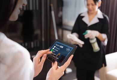 Hotel employee using a tablet