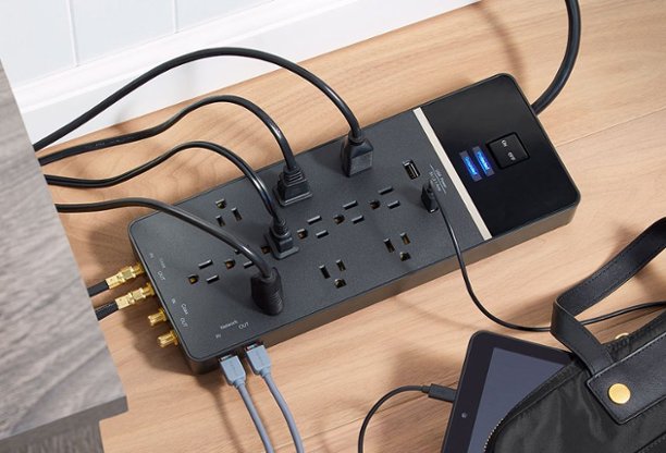 Cords and cables connected to a surge protector