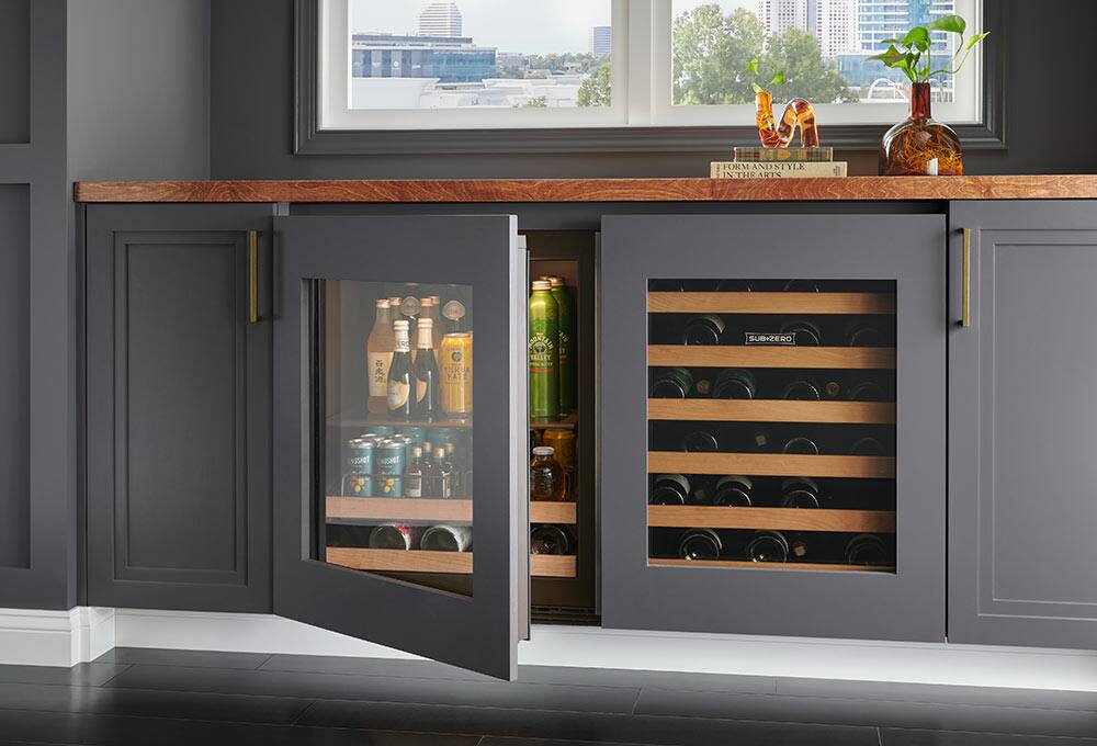 Black undercounter refrigerator built into counter