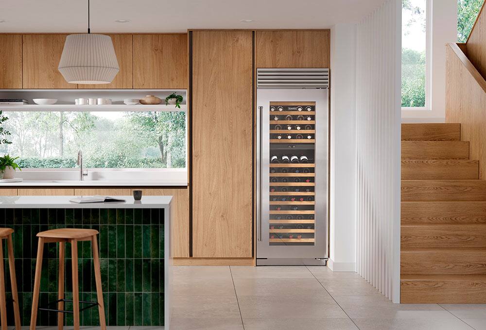 Wine cooler in green and brown kitchen