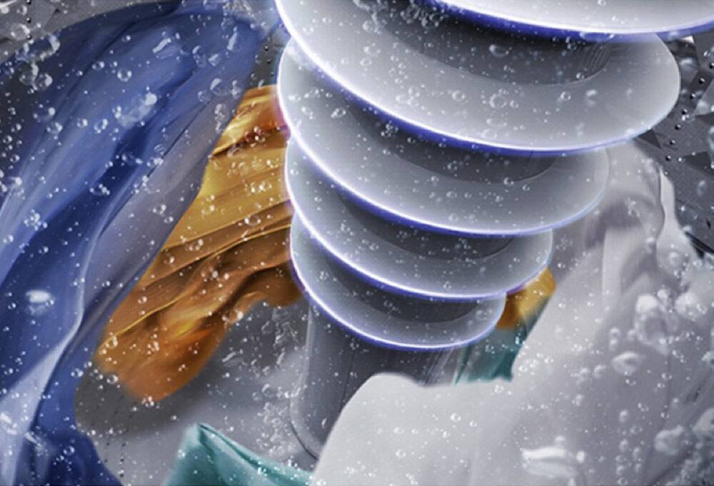 Agitator moving water and laundry inside washer