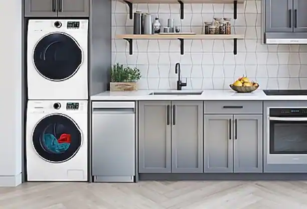 Stacked washer and dryer in kitchen