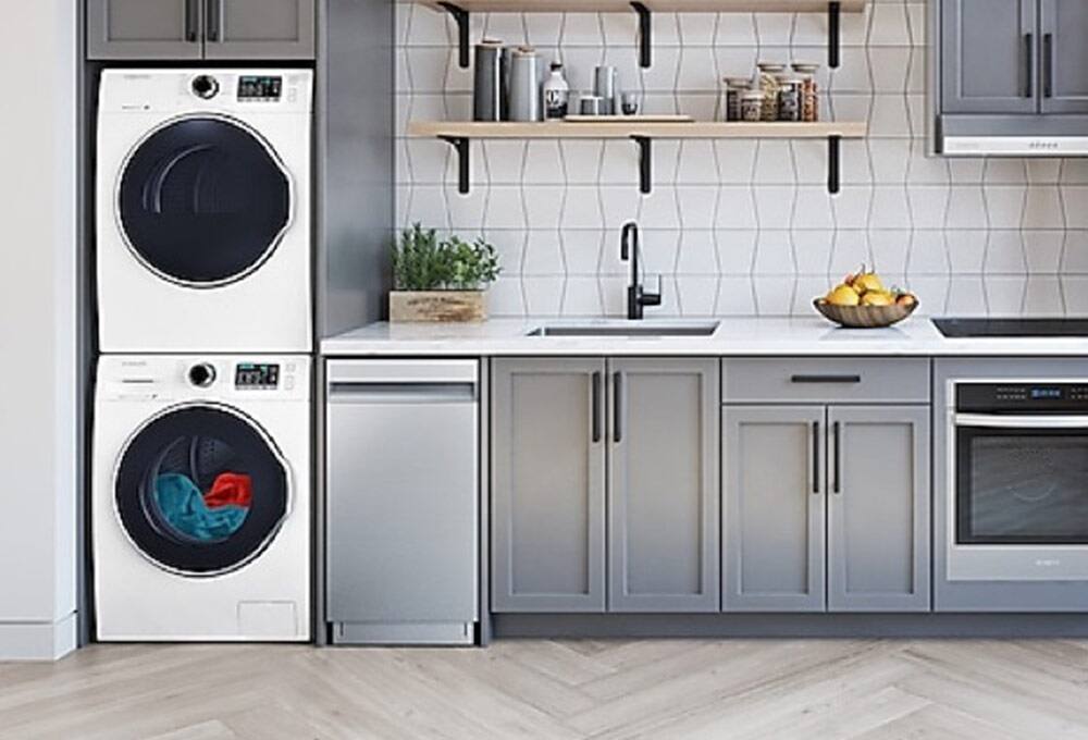 Stacked washer and dryer in kitchen