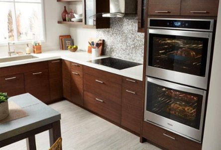 Brown and white kitchen with stainless steel appliances