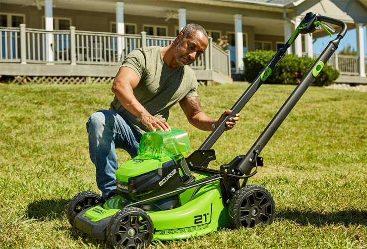 Man starting lawn mower