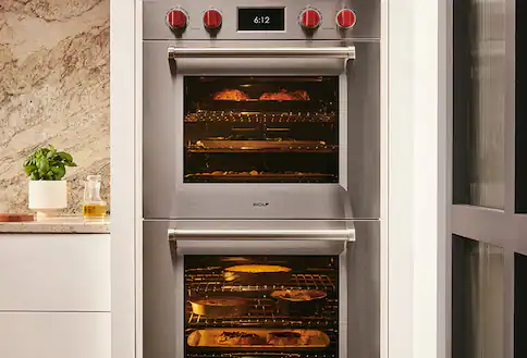 Stacked built-in range in white wall