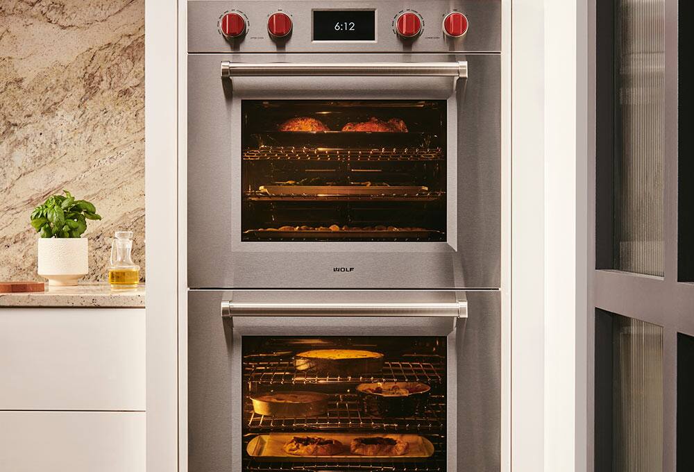 Stacked built-in range in white wall