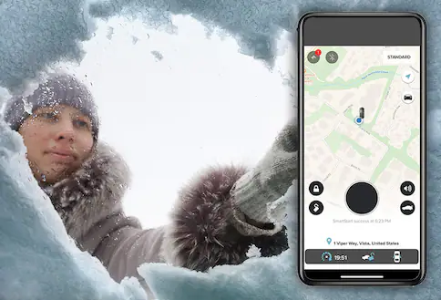 Smartphone and person scraping snow from windows