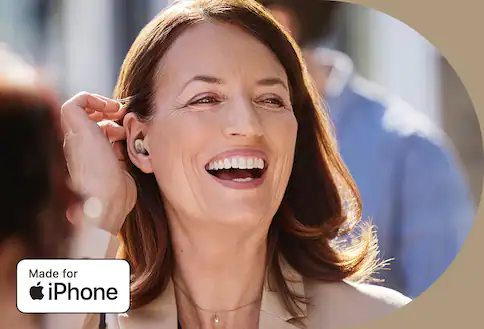 Person wearing earbuds that help with hearing