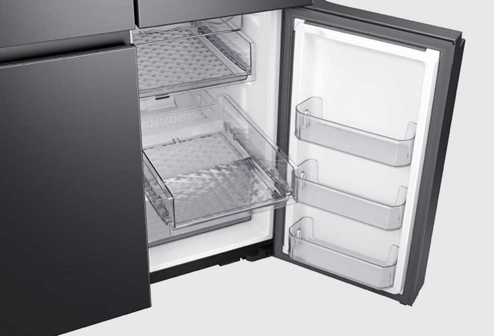 Open bottom right door on refrigerator showing slide-out shelf