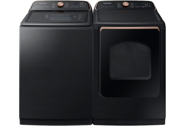 Black washer and dryer with gold dials and trim