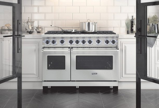 Stainless steel double-oven range in white kitchen