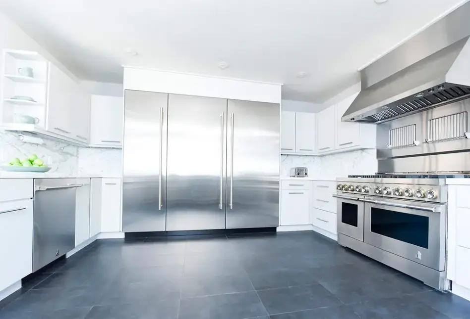 Kitchen with built-in stainless steel appliances