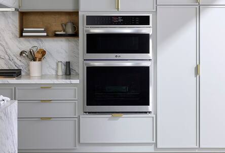 Kitchen with wall oven, range hood, cooktop