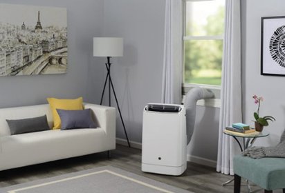 Portable air conditioner venting to window in living room