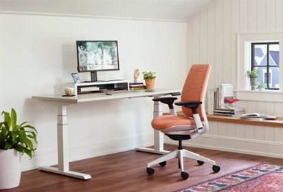 Office desk and chair in sunlit home office
