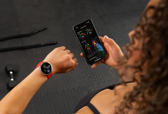 woman views fitness tracker watch