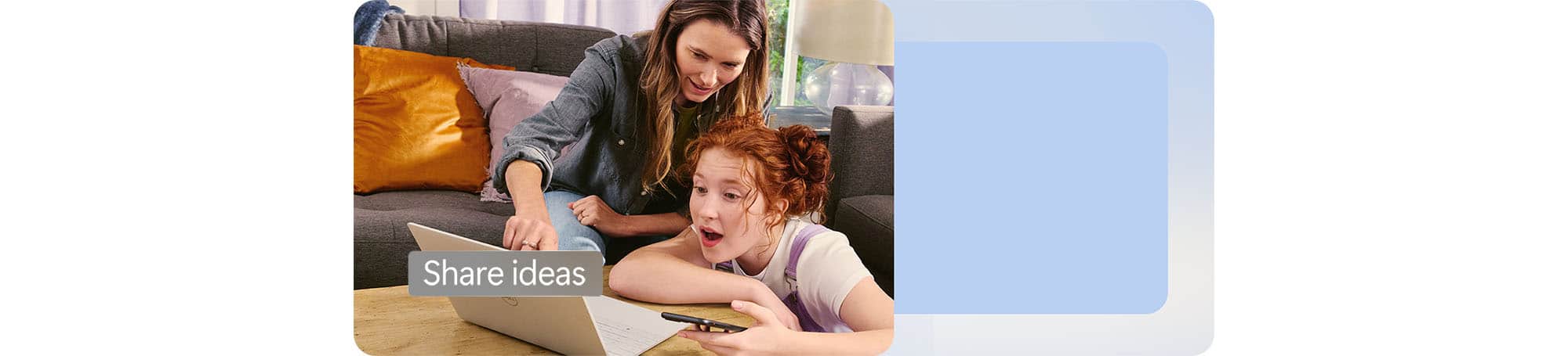 Adult and child looking at a device