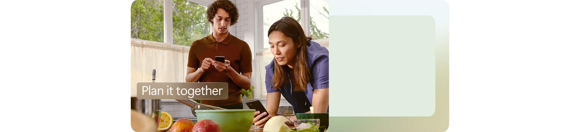 Two people looking at their phones