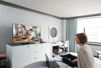 Person watching TV in a hotel room