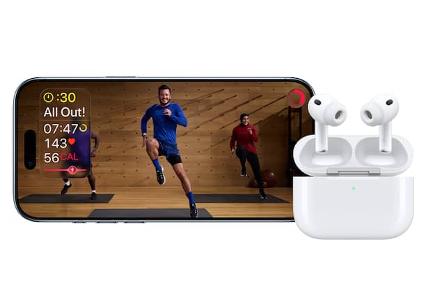 People exercising, displayed on an iPhone; AirPods