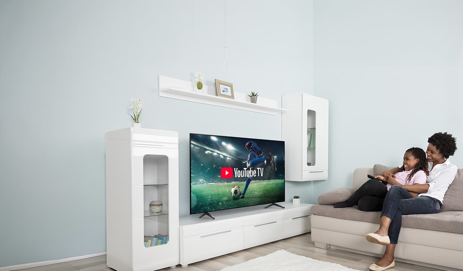 YouTube TV, soccer player on a field, living room