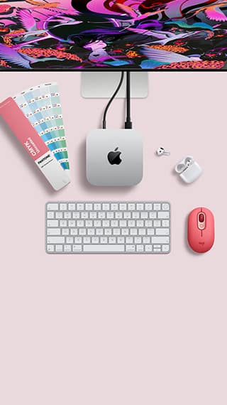 Mac mini, top, silver aluminum, rounded corners, glossy black Apple logo centered, connected by cord, Studio Display partially visible on top, AirPods 4, open, Pantone color swatches, Magic Keyboard, and mouse