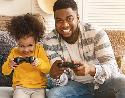 Man and girl playing video games