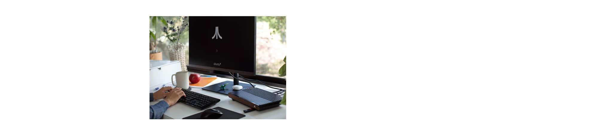 Woman sitting at desk using computer