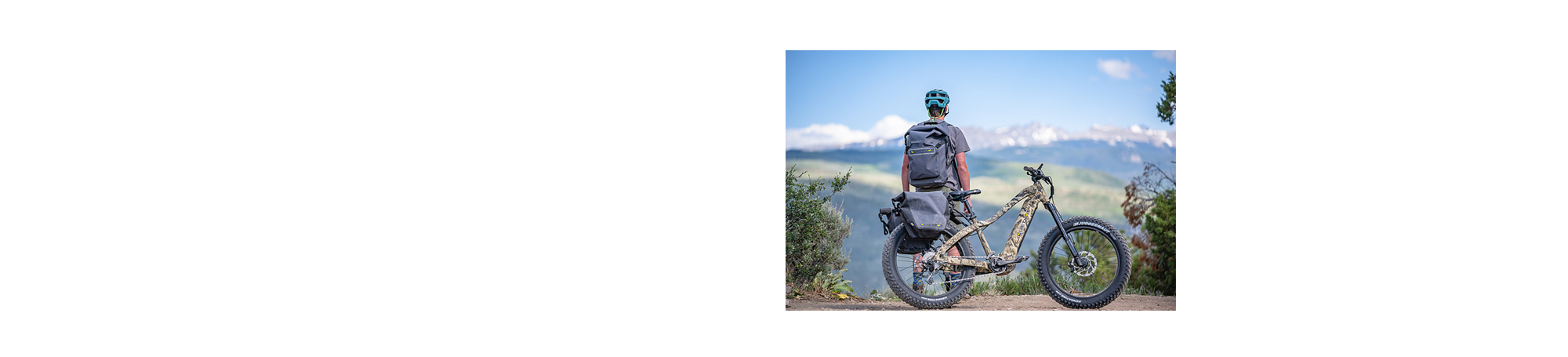 Man with his e-bike looking at mountains