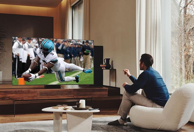 Man watching football on TV