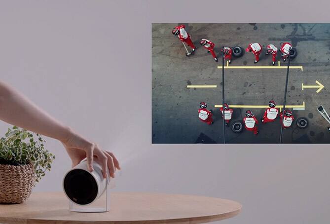 Person adjusting projector